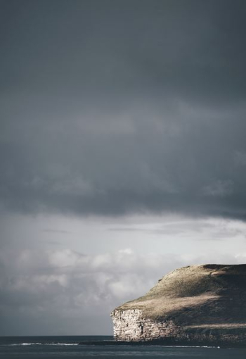 gray rock formation under gray sky