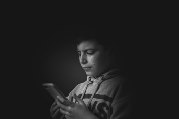 Gray-scale Photo of Boy Holding Smartphone Gray-scale Photo of Boy Holding Smartphone
