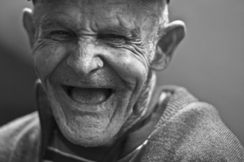 Grayscale Photo of Laughing Old Man Grayscale Photo of Laughing Old Man
