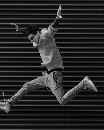Grayscale Photo Of Man Jumping Grayscale Photo Of Man Jumping