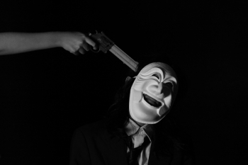 Grayscale Photo of Person Holding a Gun Grayscale Photo of Person Holding a Gun