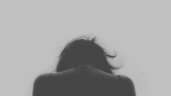 grayscale photo of person's back grayscale photo of person's back