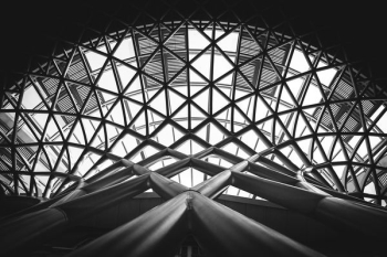 grayscale photo of scaffolding grayscale photo of scaffolding