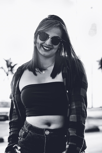 Grayscale Photo of Smiling Woman in Tube Top Grayscale Photo of Smiling Woman in Tube Top