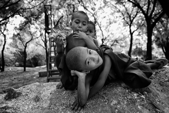 Grayscale Photo of Three Children Near Trees Grayscale Photo of Three Children Near Trees