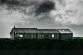 grayscale photo of wooden barn