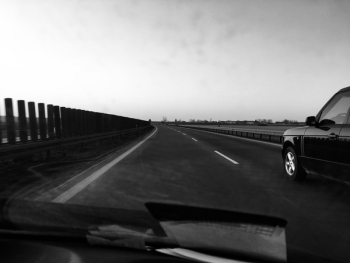 Grayscale Photography of Car on Road Grayscale Photography of Car on Road