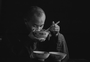 grayscale photography of eating macn