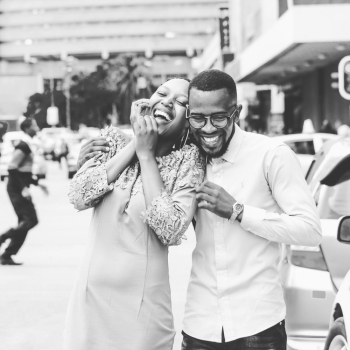 Grayscale Photography of Man and Woman Standing and Laughing Grayscale Photography of Man and Woman Standing and Laughing