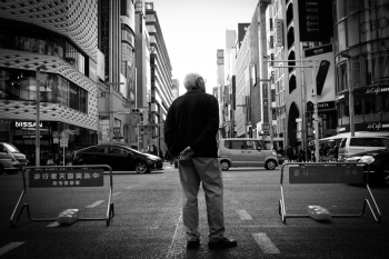 Grayscale Photography of Man Standing on Road Grayscale Photography of Man Standing on Road
