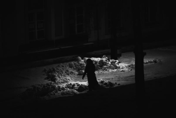 grayscale photography of person waling on street grayscale photography of person waling on street