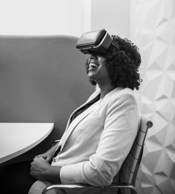 Grayscale Photography of Woman Wearing Virtual Reality Headset