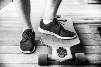 grayscaled photography of person on longboard grayscaled photography of person on longboard