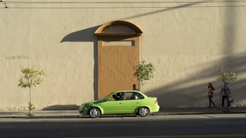 Green Car Passes Wall Green Car Passes Wall