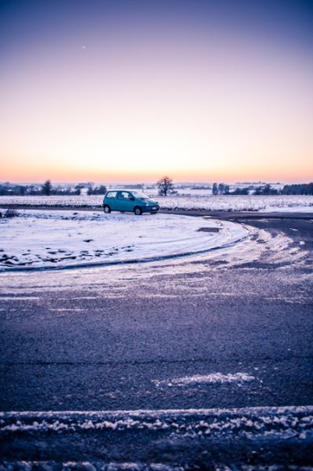 green vehicle on road green vehicle on road