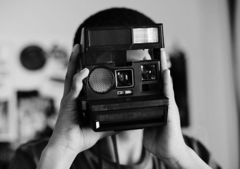greyscale photography of person taking photo greyscale photography of person taking photo