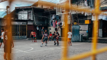 group of children playing basketball