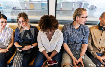 Group of diverse people riding a train Group of diverse people riding a train