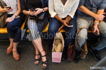 Group of diverse people riding a train Group of diverse people riding a train