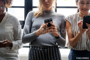Group of diverse people using smartphones Group of diverse people using smartphones