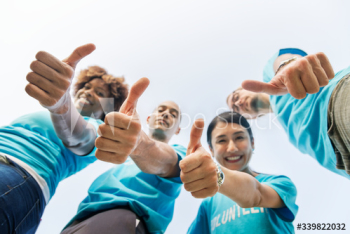 Group of happy and diverse volunteers