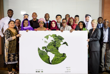 Group of People Holding Save Our Earth Poster Group of People Holding Save Our Earth Poster