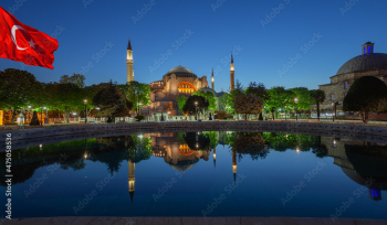 Hagia Sophia Mosque in morning with Turkish flag in Istanbul