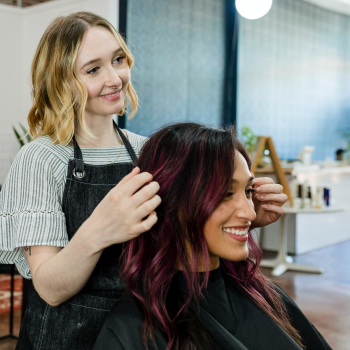 Hairstylist giving a finishing touch to… | Free stock photo | High Resolution image