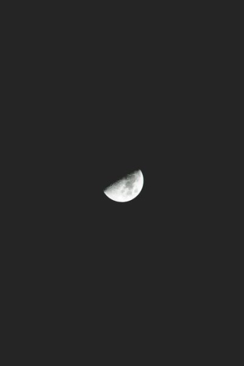 half moon against black background half moon against black background
