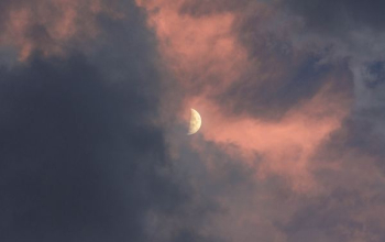 half-moon covered of clouds half-moon covered of clouds