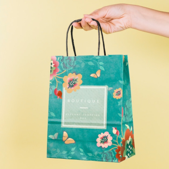 Hand holding shopping bag mockup