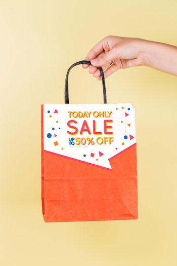 Hand holding shopping bag mockup