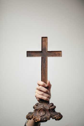 Hand Holds Up Antique Cross Hand Holds Up Antique Cross