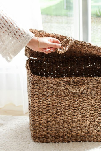 Hand Opening a Rustic Woven Storage Basket Hand Opening a Rustic Woven Storage Basket