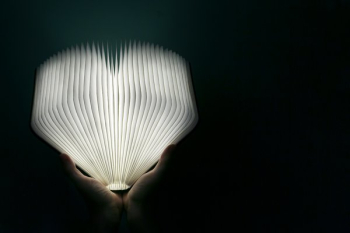 Hands Holding Glowing Book Hands Holding Glowing Book