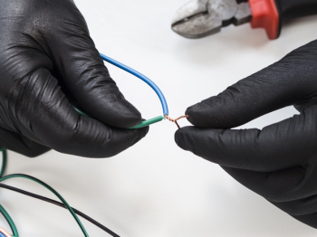 Hands with black gloves connecting wires Free Photo Hands with black gloves connecting wires Free Photo