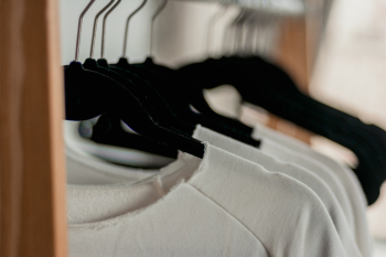 Hanged White Shirts on Black Clothes Hangers Hanged White Shirts on Black Clothes Hangers