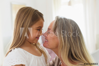 Happy affectionate grandmother and granddaughter face to face Happy affectionate grandmother and granddaughter face to face