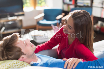 Happy couple talking on sofa Happy couple talking on sofa