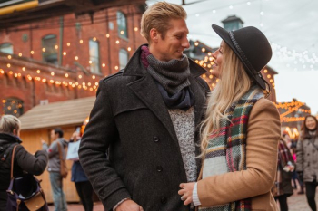 Happy Couple Under Holiday Lights Happy Couple Under Holiday Lights
