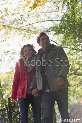 Happy couple walking in park Happy couple walking in park