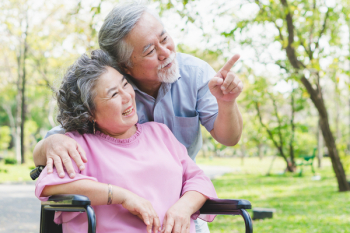 Happy elderly couple with lifestyle after retiree concept. Lovely asian seniors couple embracing together in the park in the morning.