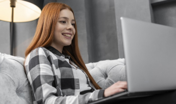 Happy female looking on laptop Free Photo Happy female looking on laptop Free Photo