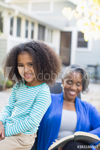 Happy granddaughter on patio with grandmother Happy granddaughter on patio with grandmother