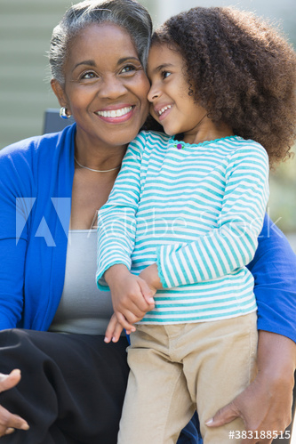 Happy grandmother and granddaughter hugging Happy grandmother and granddaughter hugging