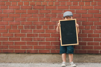 Happy Little Boy Holding Blank Chalkboard Happy Little Boy Holding Blank Chalkboard