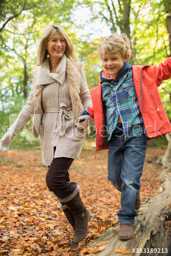 Happy mother and son in autumn woods Happy mother and son in autumn woods