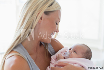 Happy mother holding baby daughter Happy mother holding baby daughter