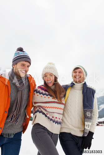 Happy playful friends walking in snow Happy playful friends walking in snow
