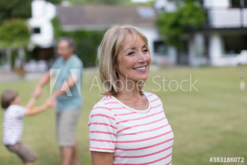 Happy senior woman in backyard Happy senior woman in backyard